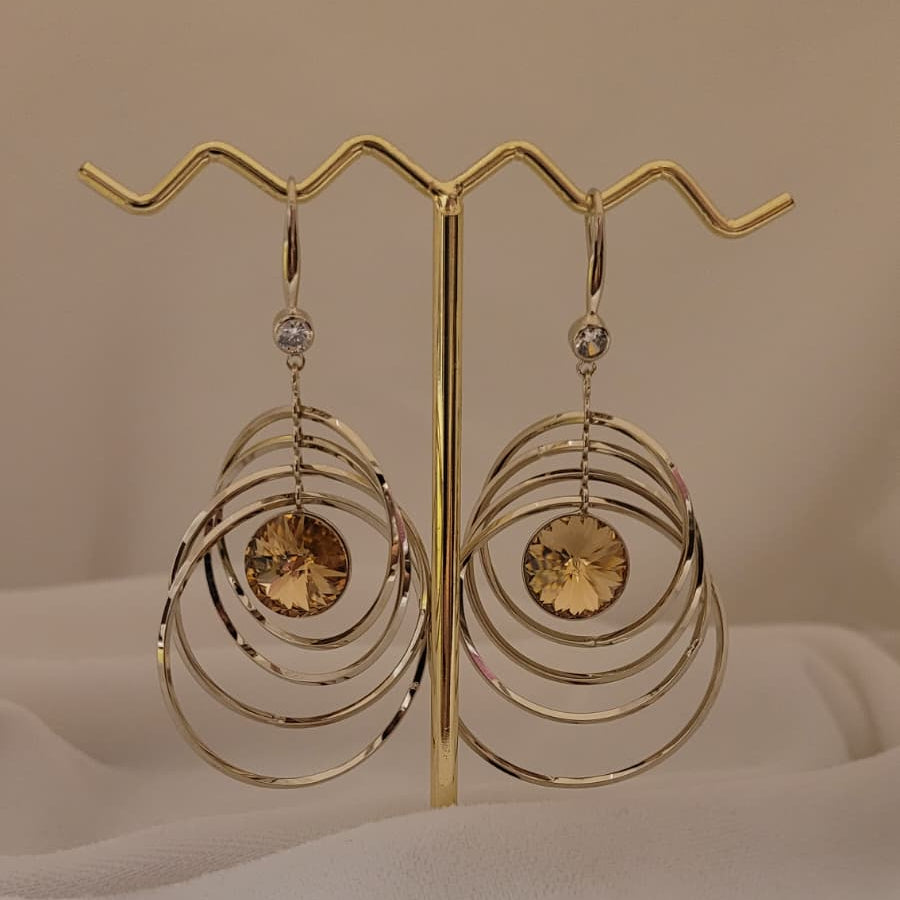 Kinetic Concentric Hoop Drop Earrings with Bright Orange Crystal Center